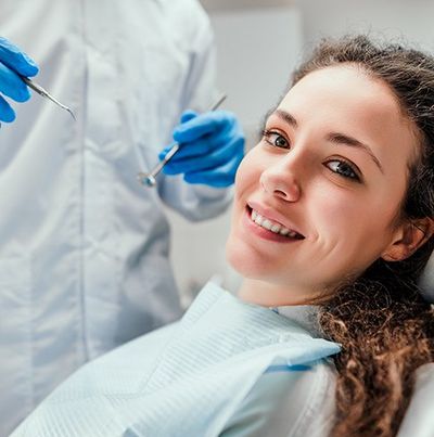 Woman Receiving Dental Checkup — Empire, MI — Empire Family Dental