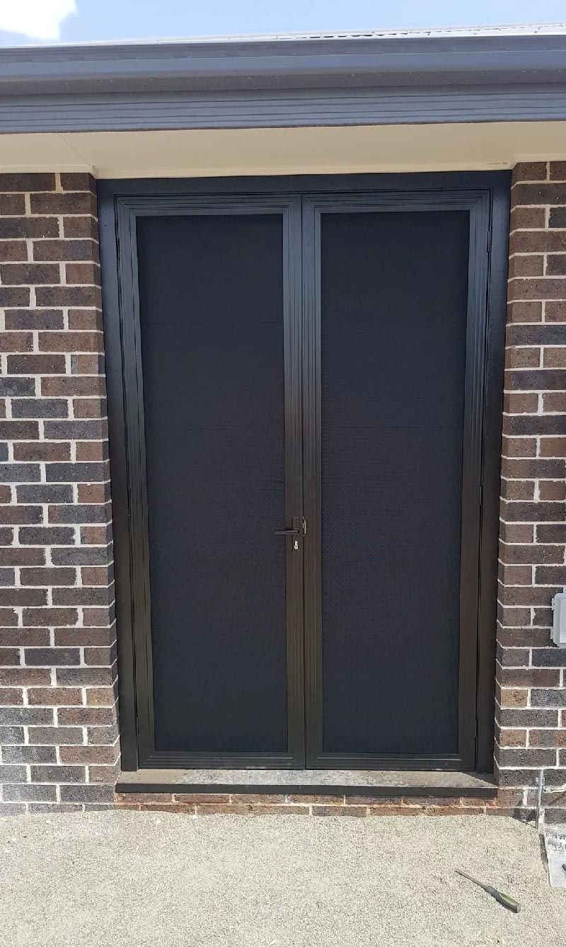 Door with Mesh Protection — Capitol Glass in Taminda, NSW