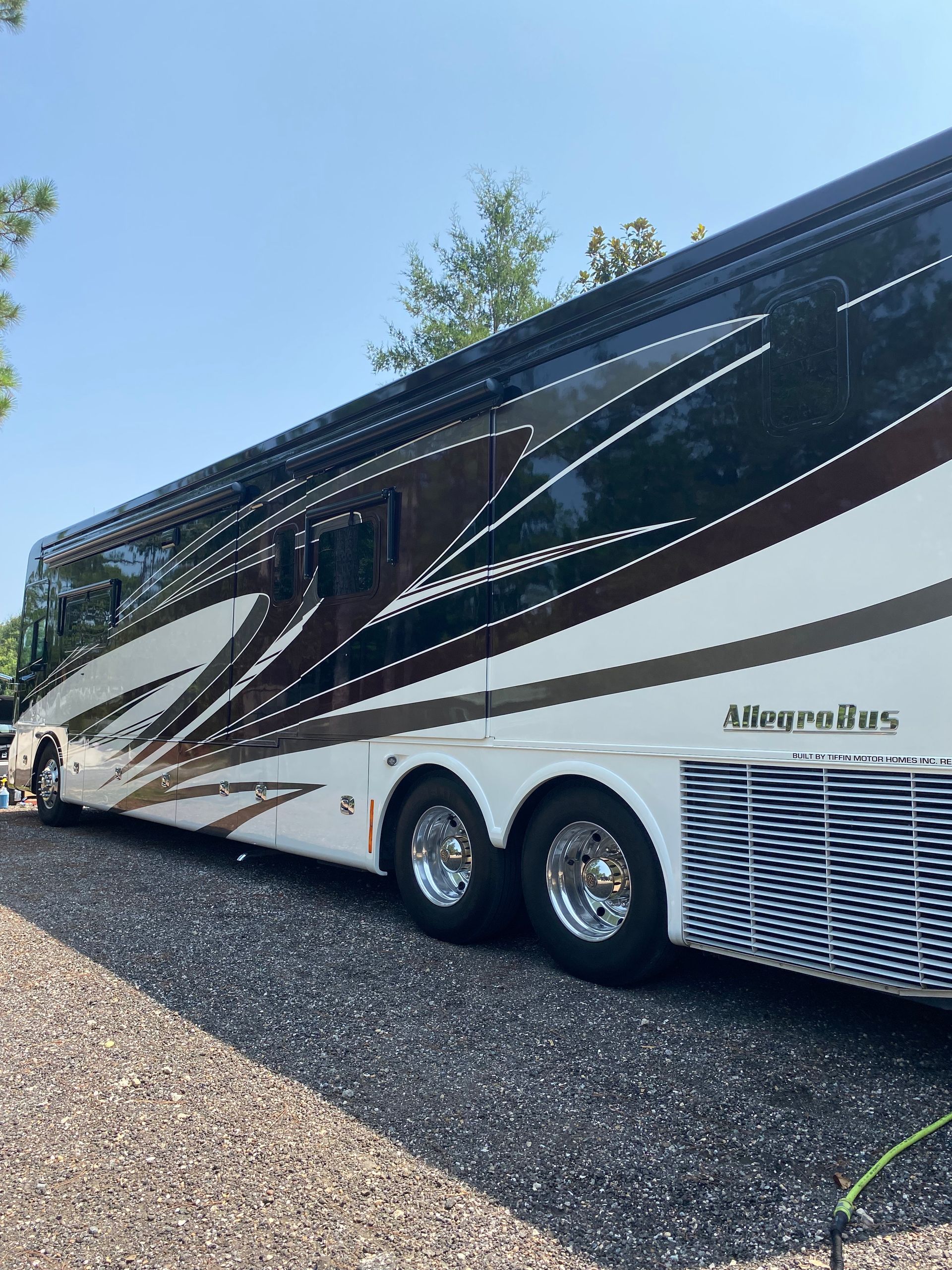 A large rv is parked on the side of the road