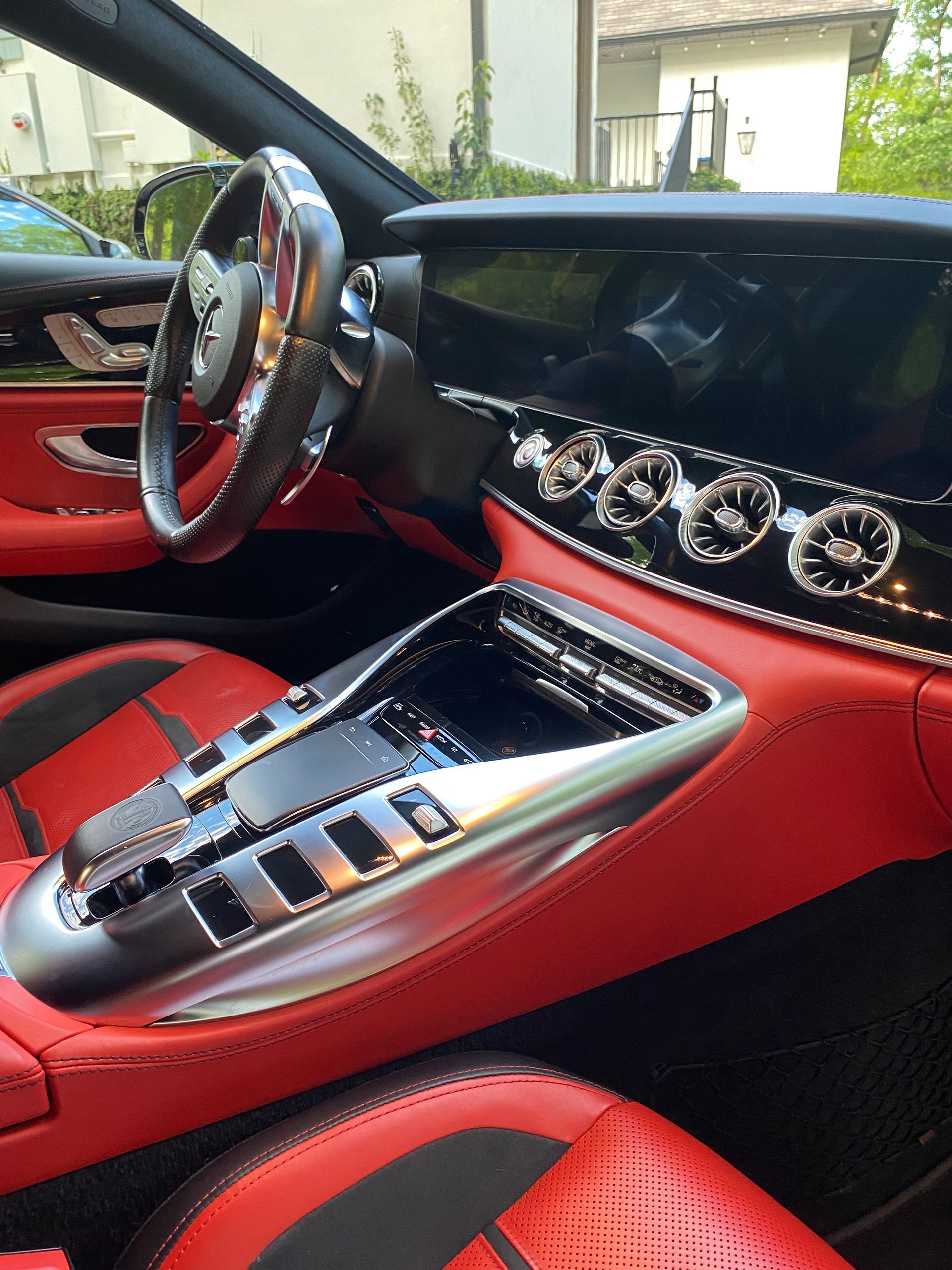 A car with red seats and a steering wheel