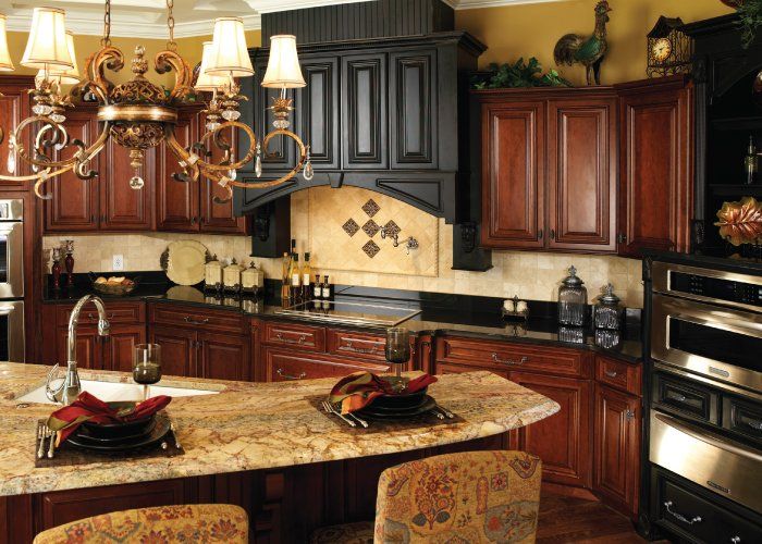 A kitchen with stainless steel appliances and wooden cabinets