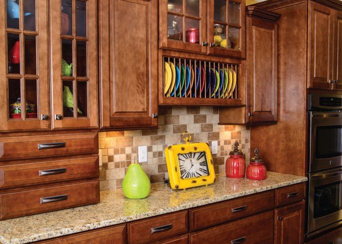 A kitchen with wooden cabinets and granite counter tops