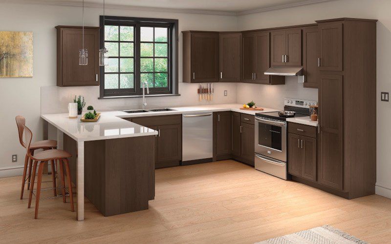 A kitchen with brown cabinets and stainless steel appliances