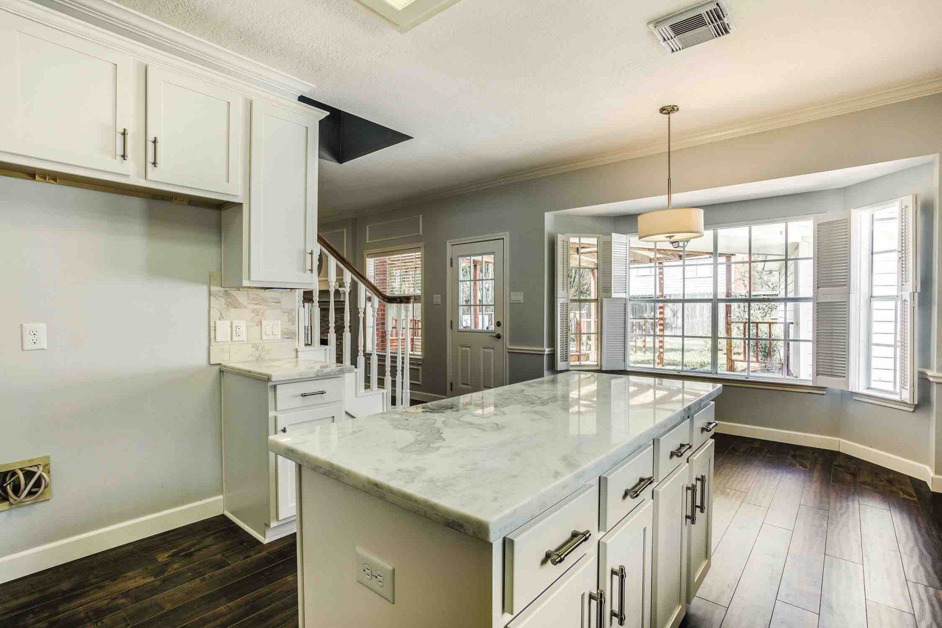 There is a large island in the middle of the kitchen.