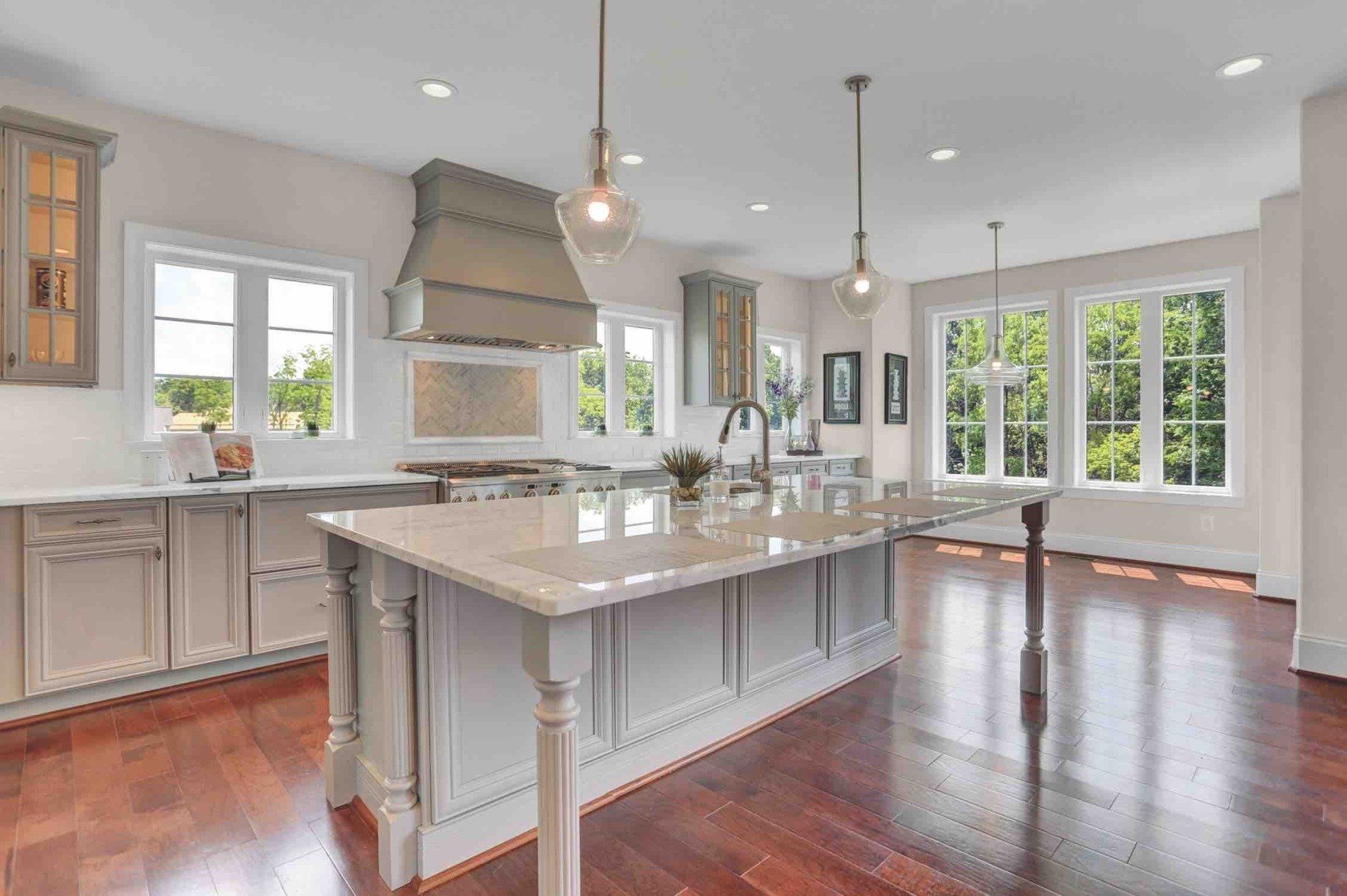 There is a large island in the middle of the kitchen.