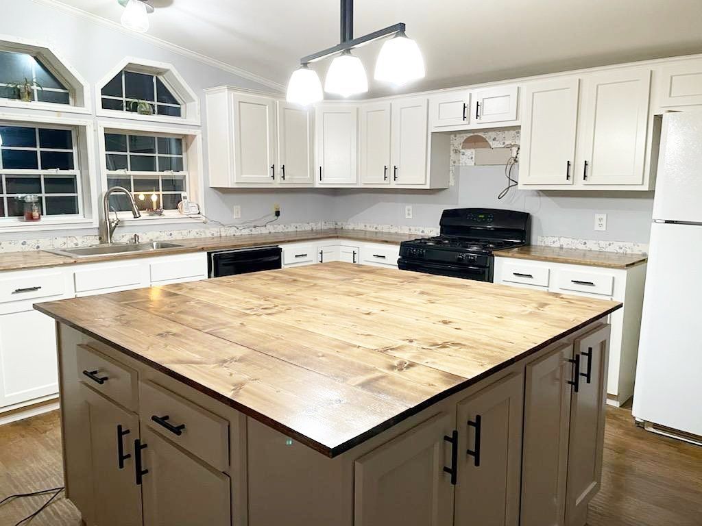 There is a large island in the middle of the kitchen.