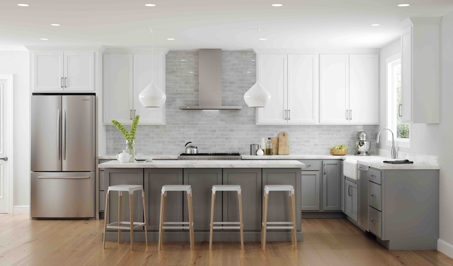 A kitchen with gray cabinets , white cabinets , stainless steel appliances and a large island.