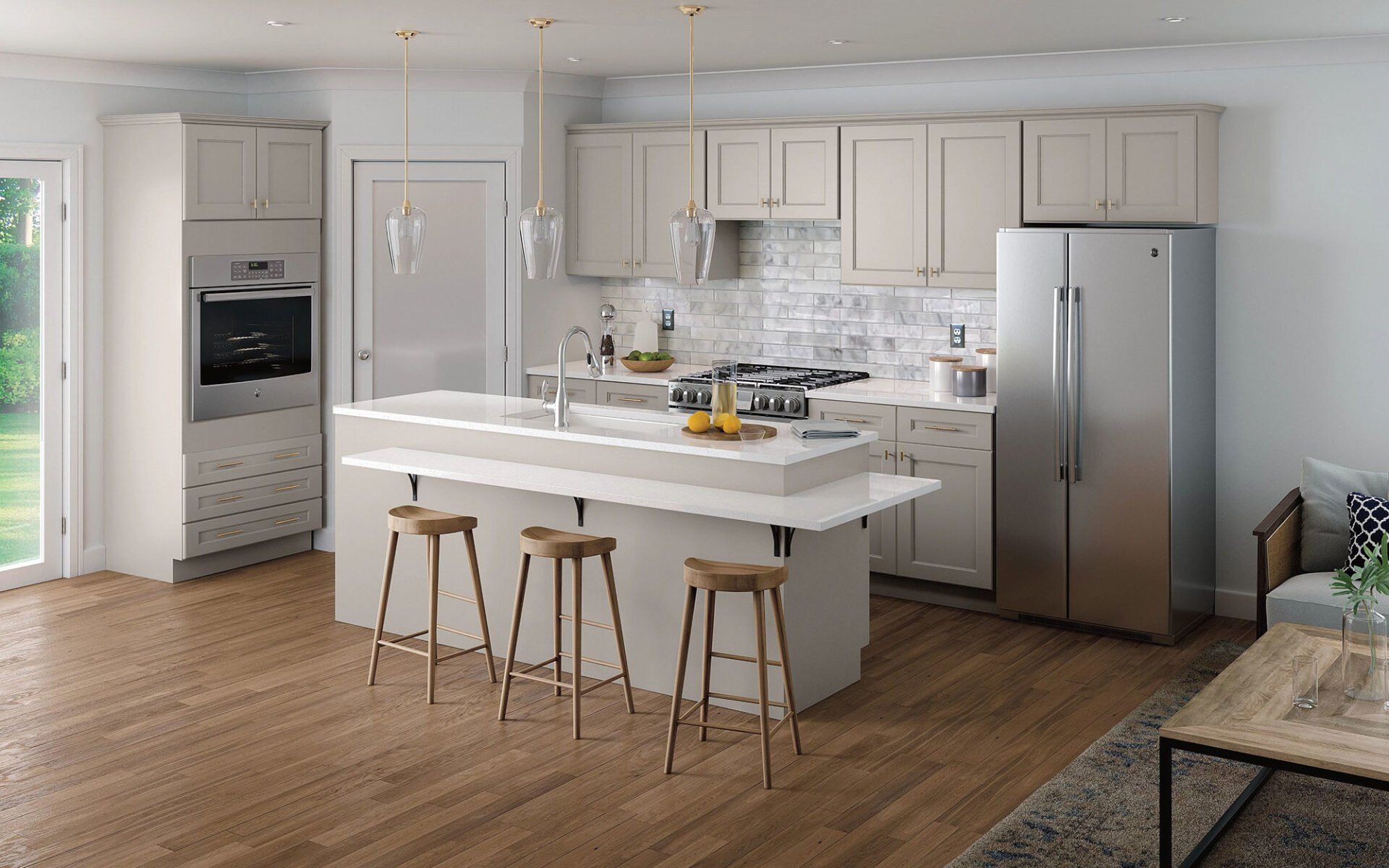 A kitchen with white cabinets , stainless steel appliances and a large island