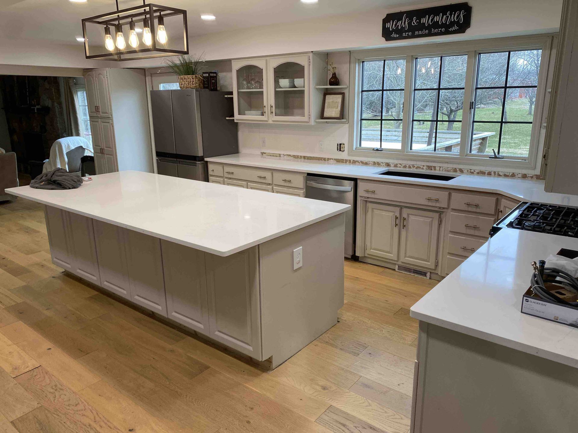 There is a large island in the middle of the kitchen.