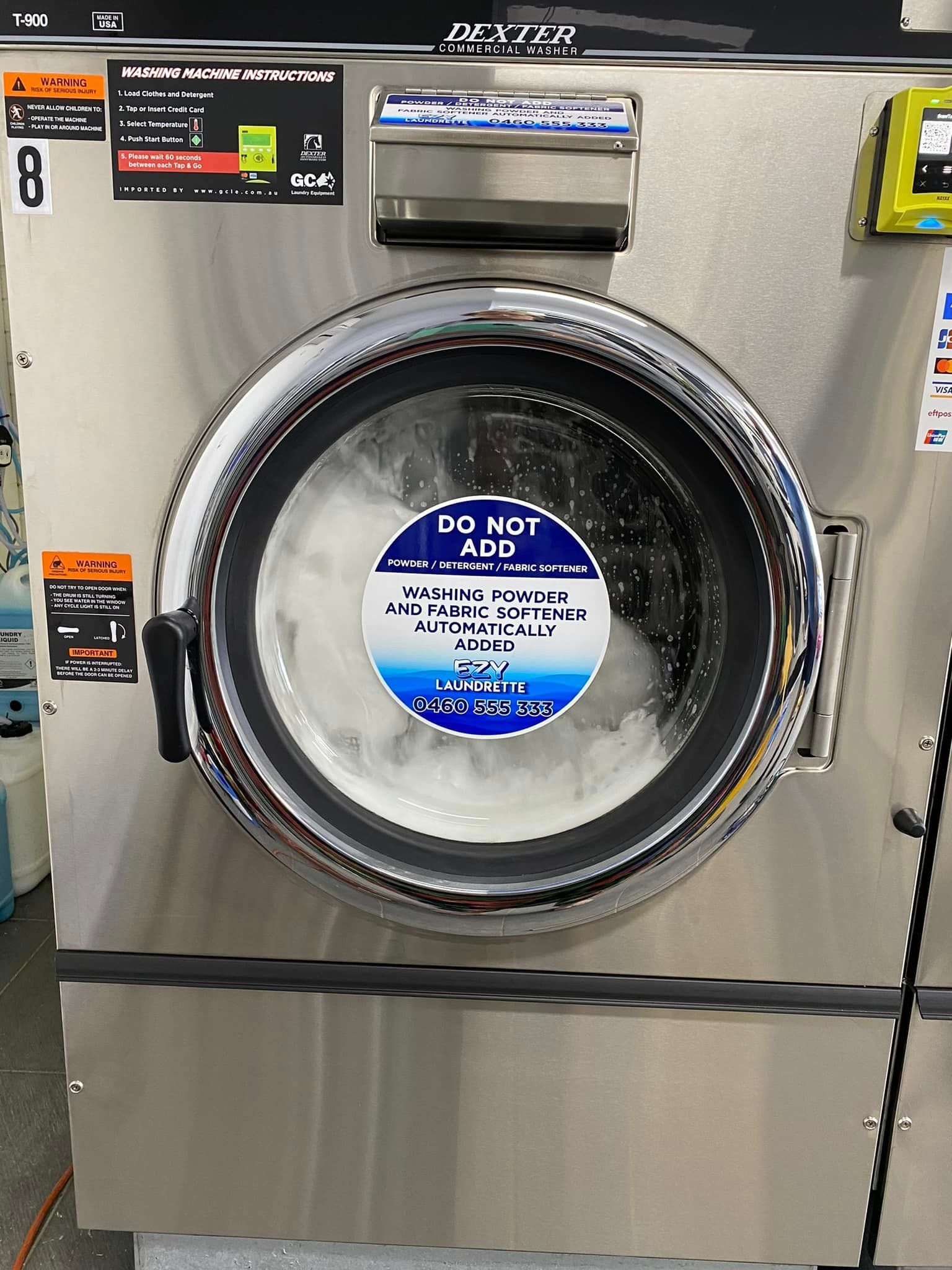 A Stainless Steel Washing Machine with A Do Not Disturb Sign on It — Ezy Laundrette Diamond Beach in Diamond Beach, NSW