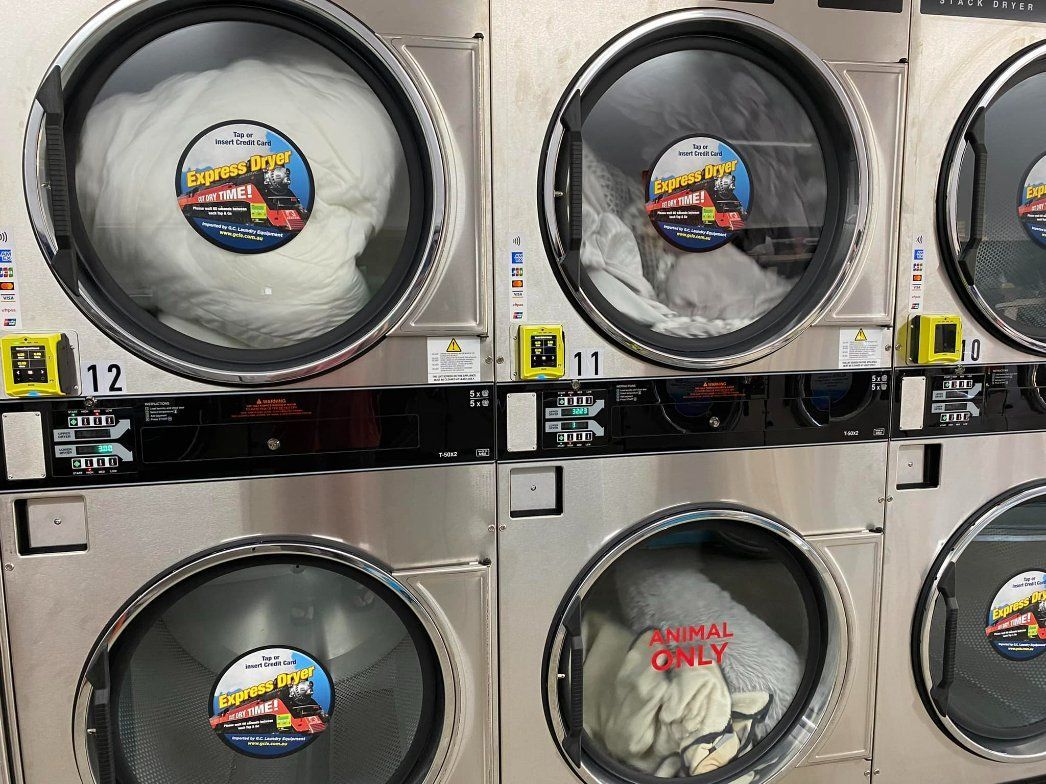 A Laundromat with A Lot of Washers and Dryers Stacked on Top of Each Other — Ezy Laundrette Diamond Beach in Nabiac, NSW