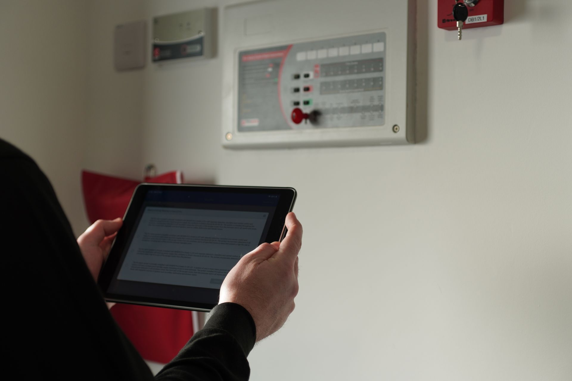 A group of people are looking at a blueprint on a table.