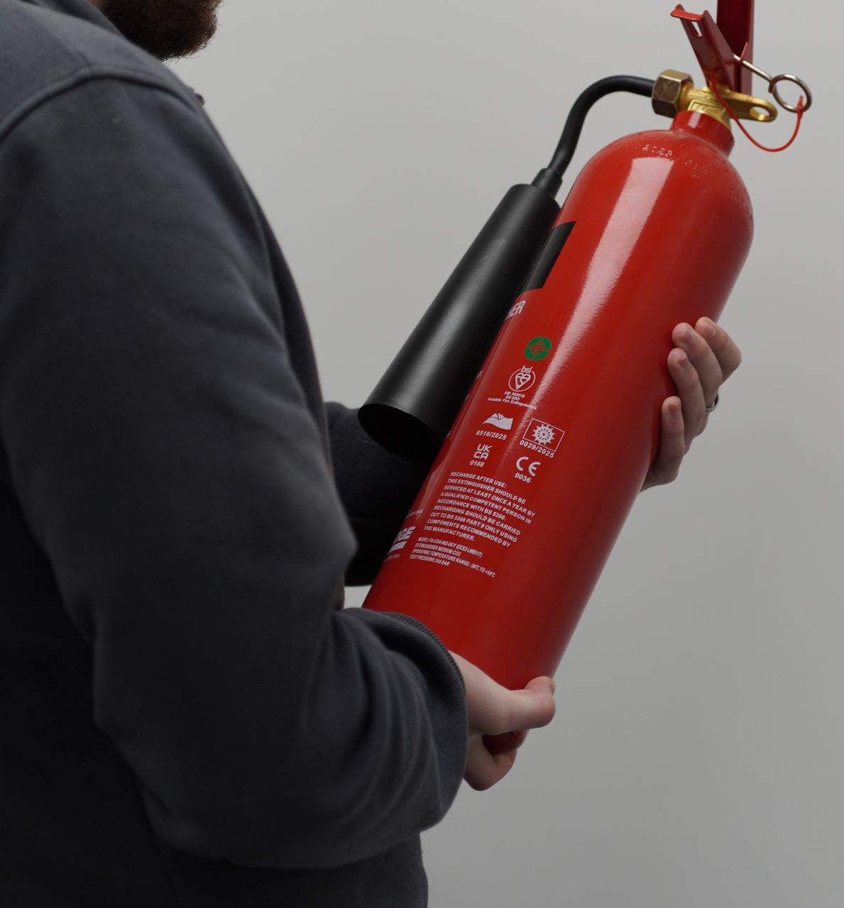 A group of people are looking at a blueprint on a table.