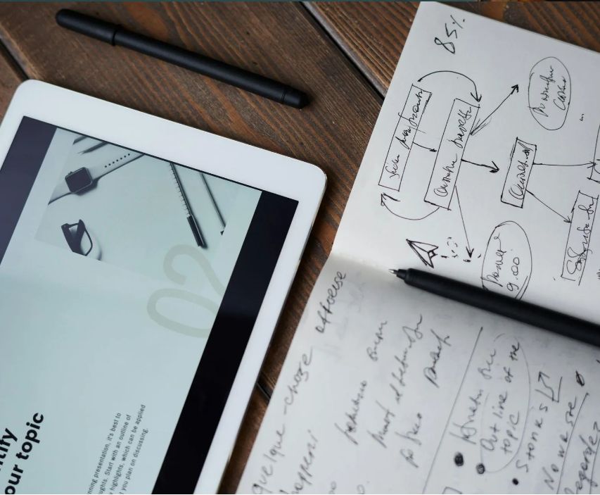 A tablet is open to a page that says 