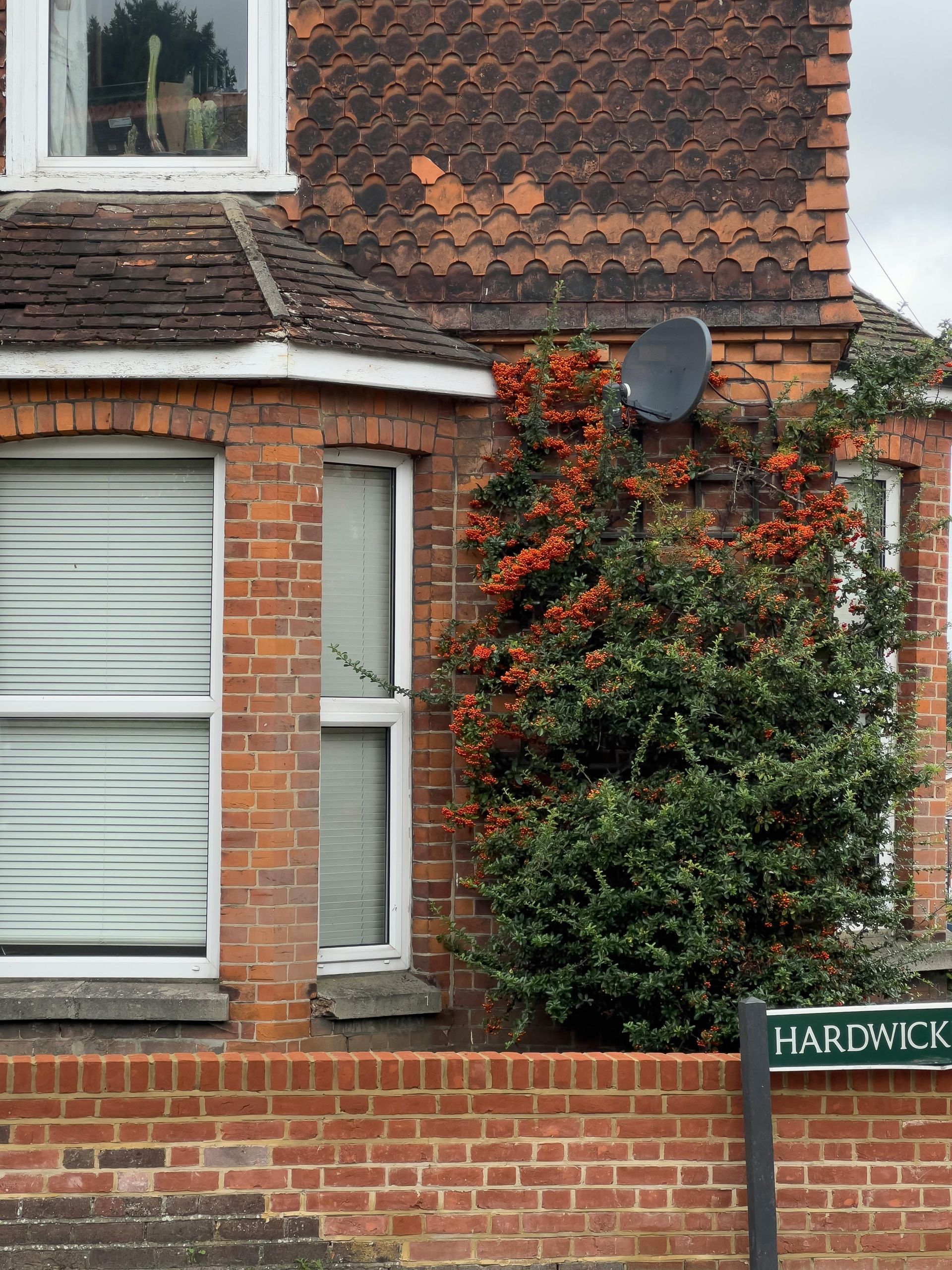 A brick house with a sign that says hardwick