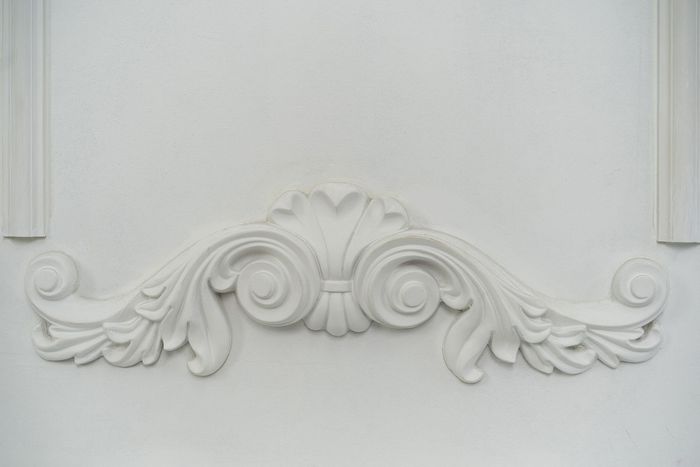 a close up of a white wall decoration