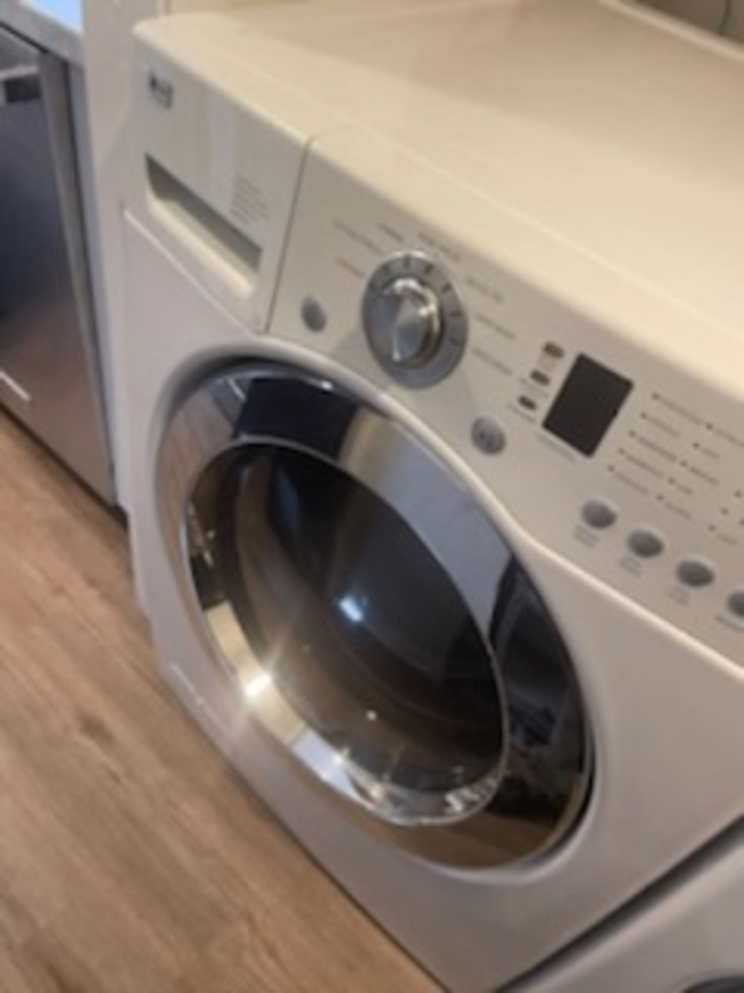 A white washer and dryer in a laundry room
