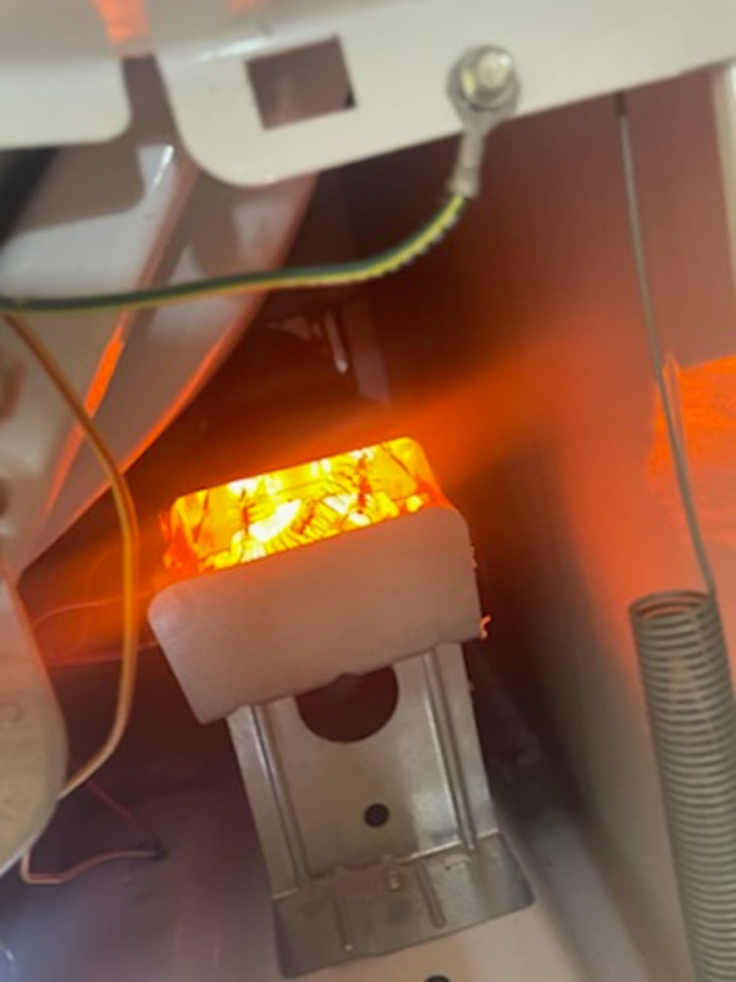 A close up of a light that is glowing in the dark.