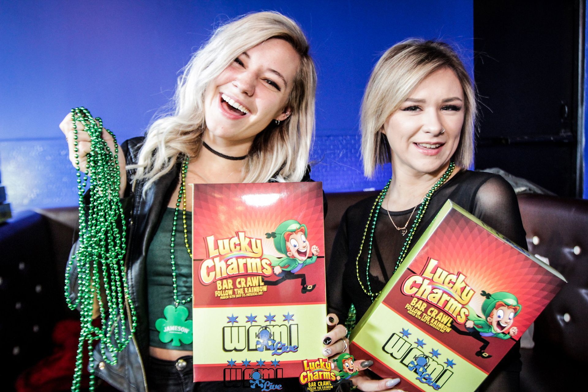 Two women are holding lucky charms in their hands.