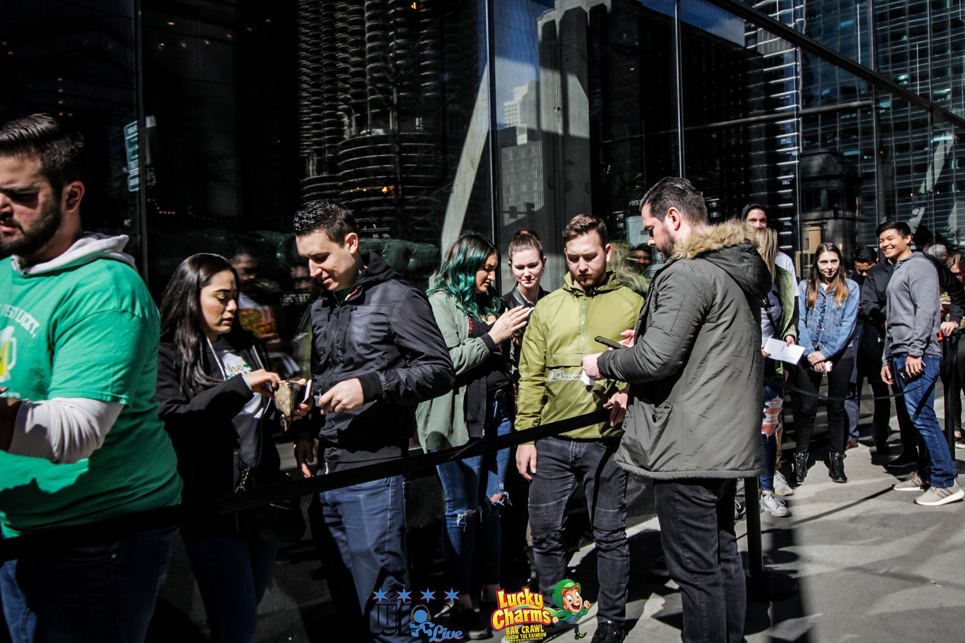 A group of people are standing outside of a building.