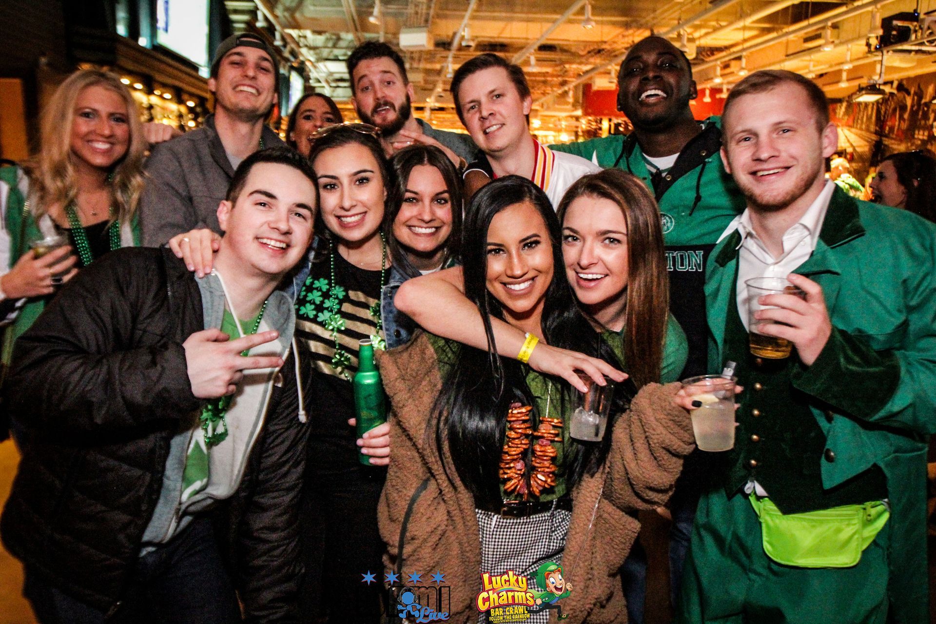 A group of people are posing for a picture in a bar.