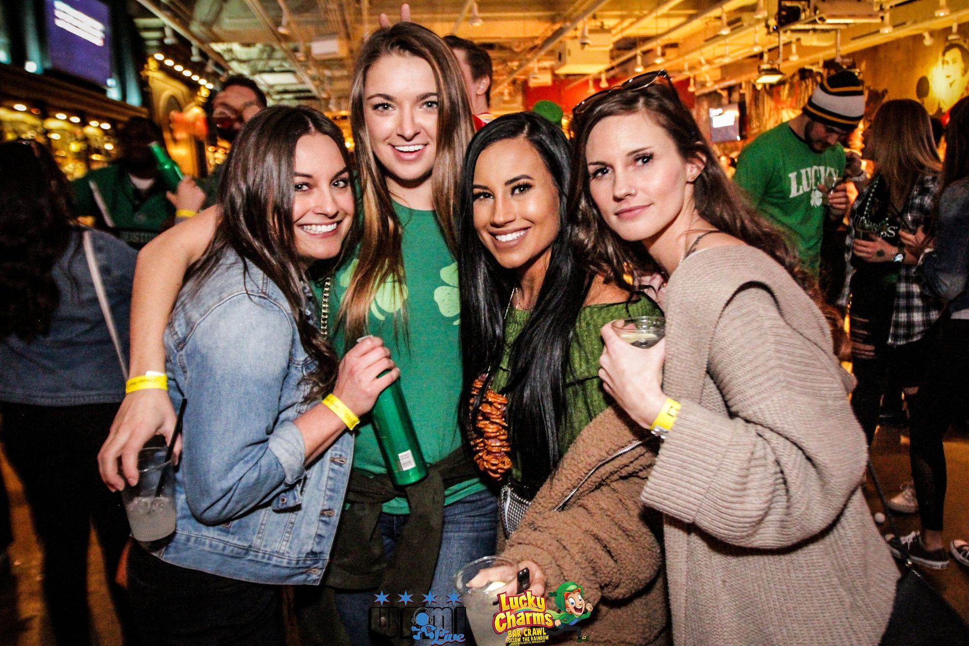 A group of women are posing for a picture at a party.
