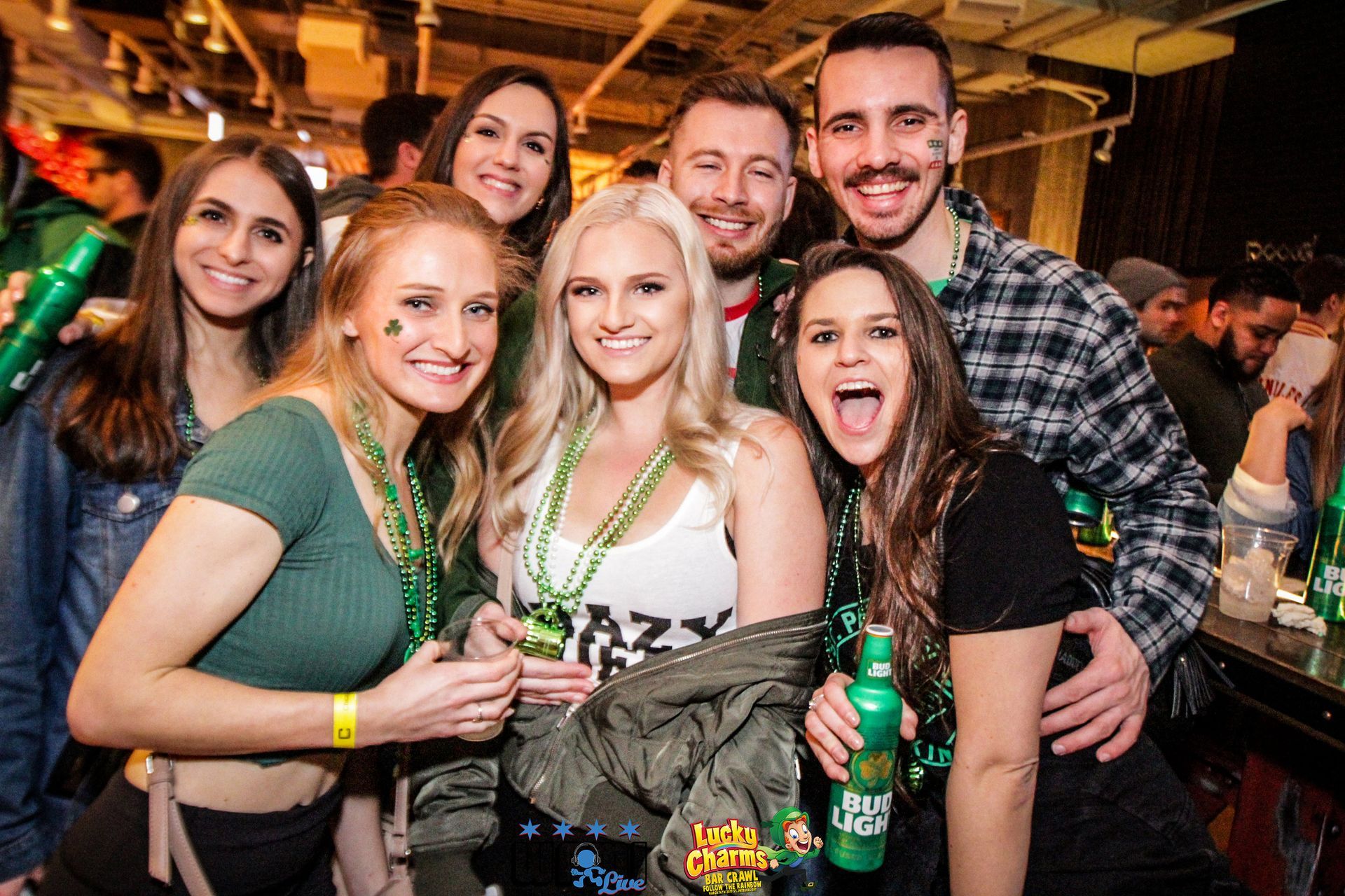 A group of people are posing for a picture at a party.