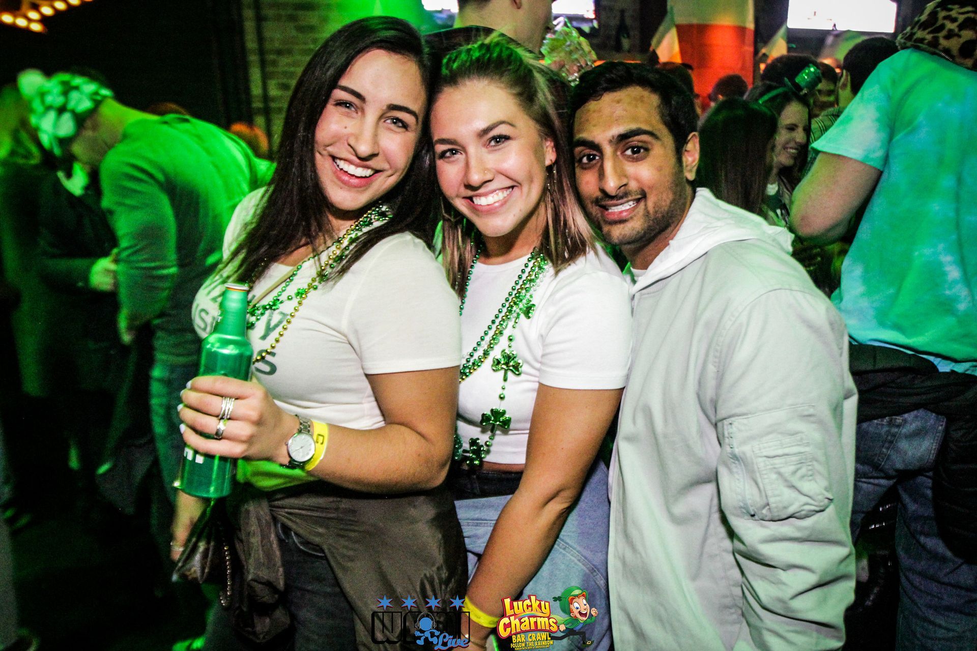 A group of people are posing for a picture at a party.