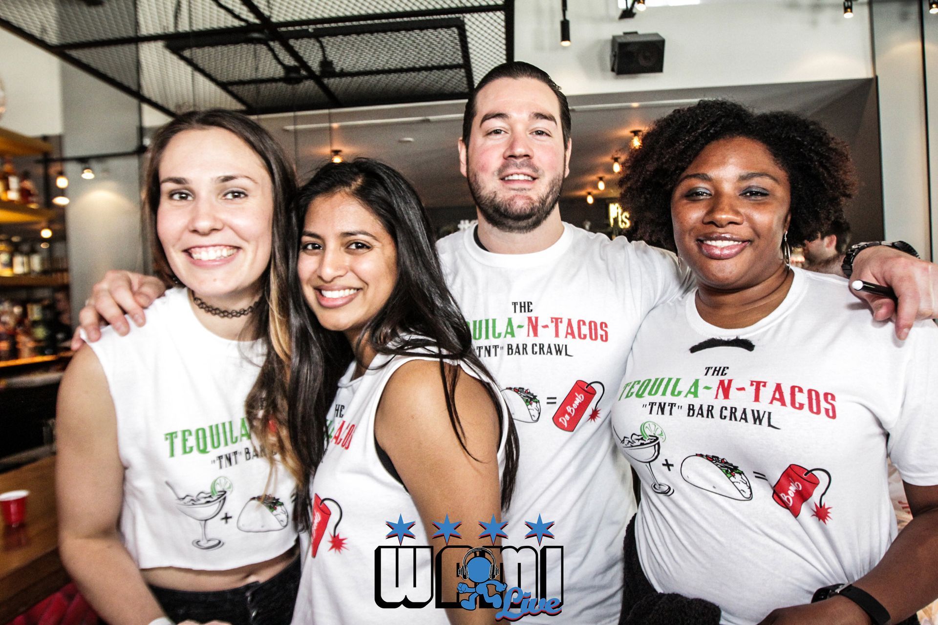 A group of people are posing for a picture in a restaurant.