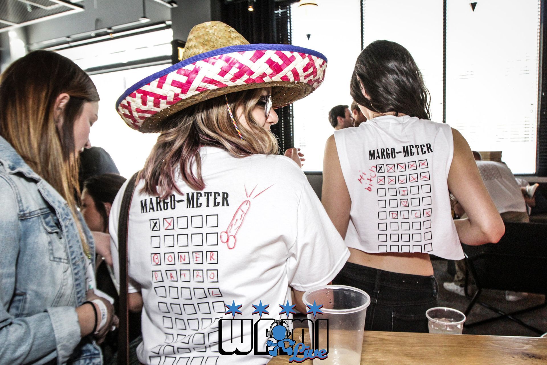 A woman wearing a sombrero and a shirt that says manchester