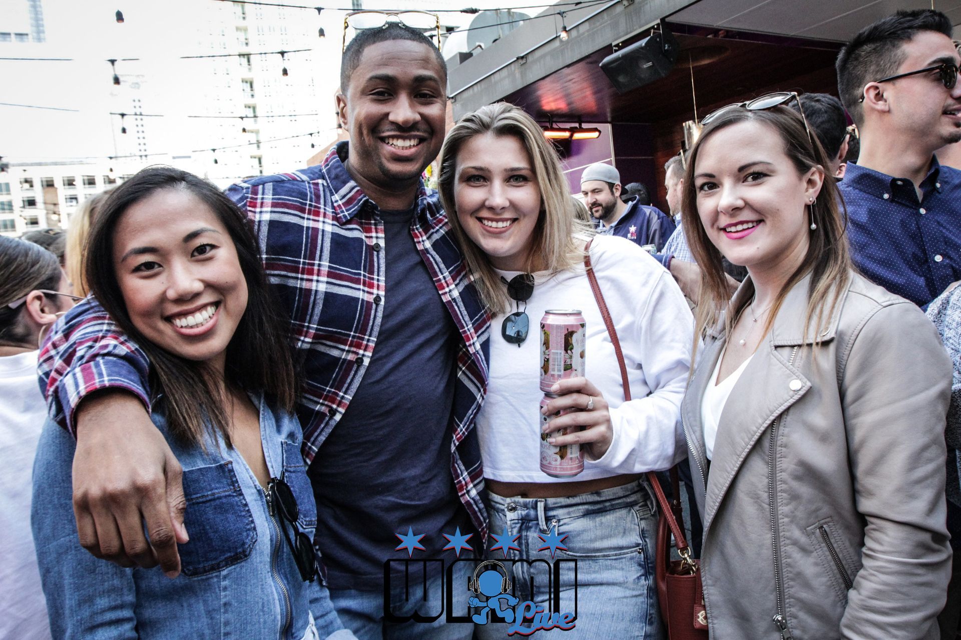 A group of people are posing for a picture at a party.