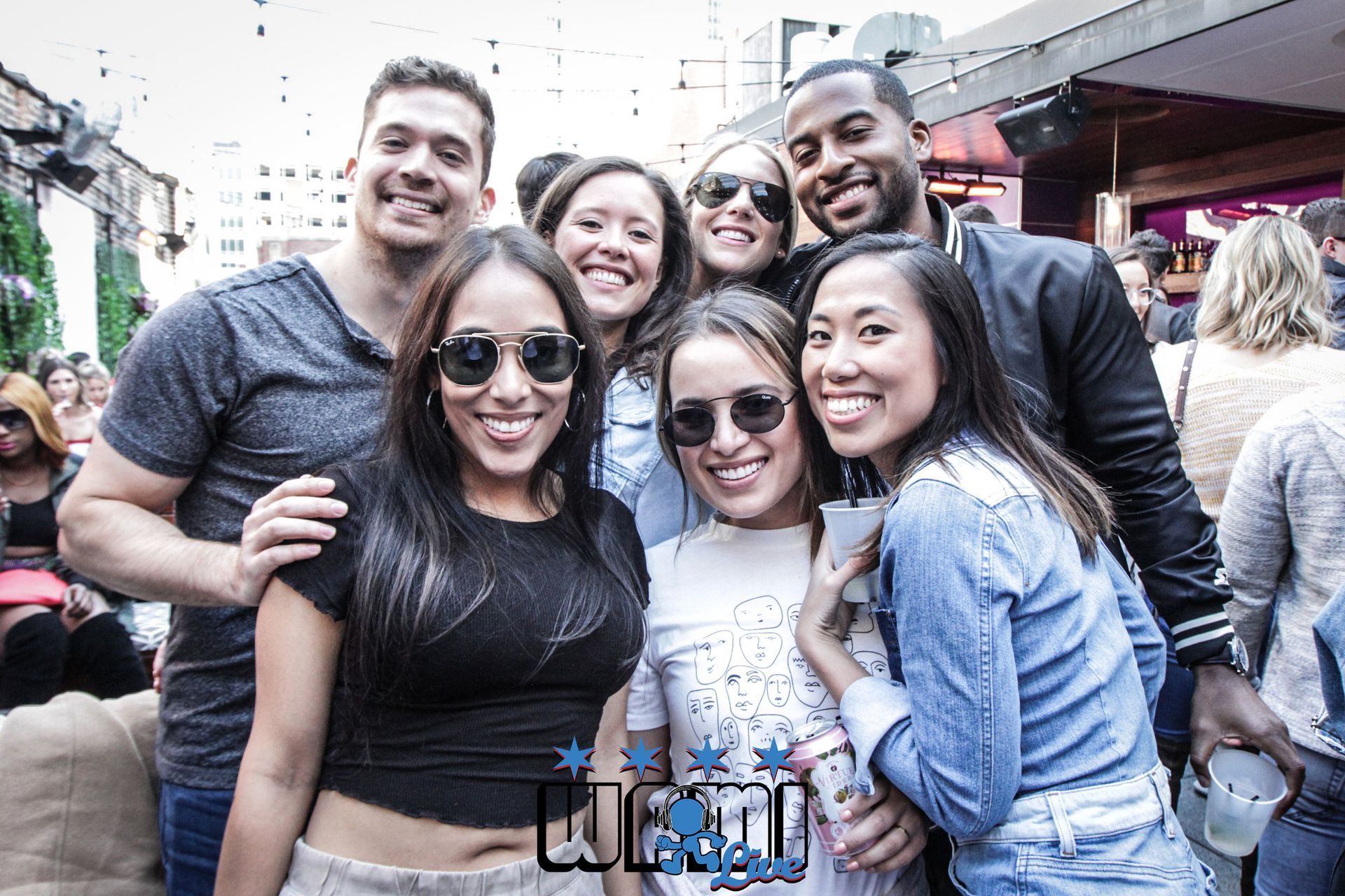 A group of people are posing for a picture at a party.