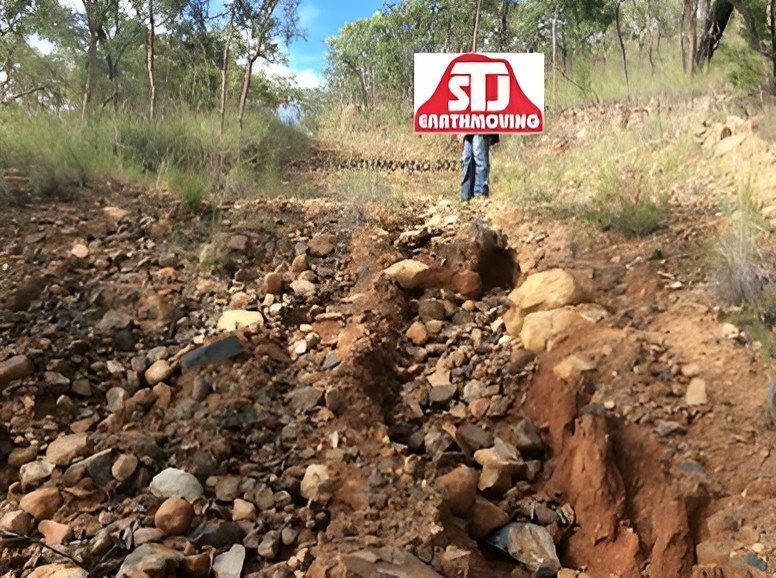A Person Holding a Sign That Says Sd Earthmoving — STJ Earthmoving in Mareeba, QLD