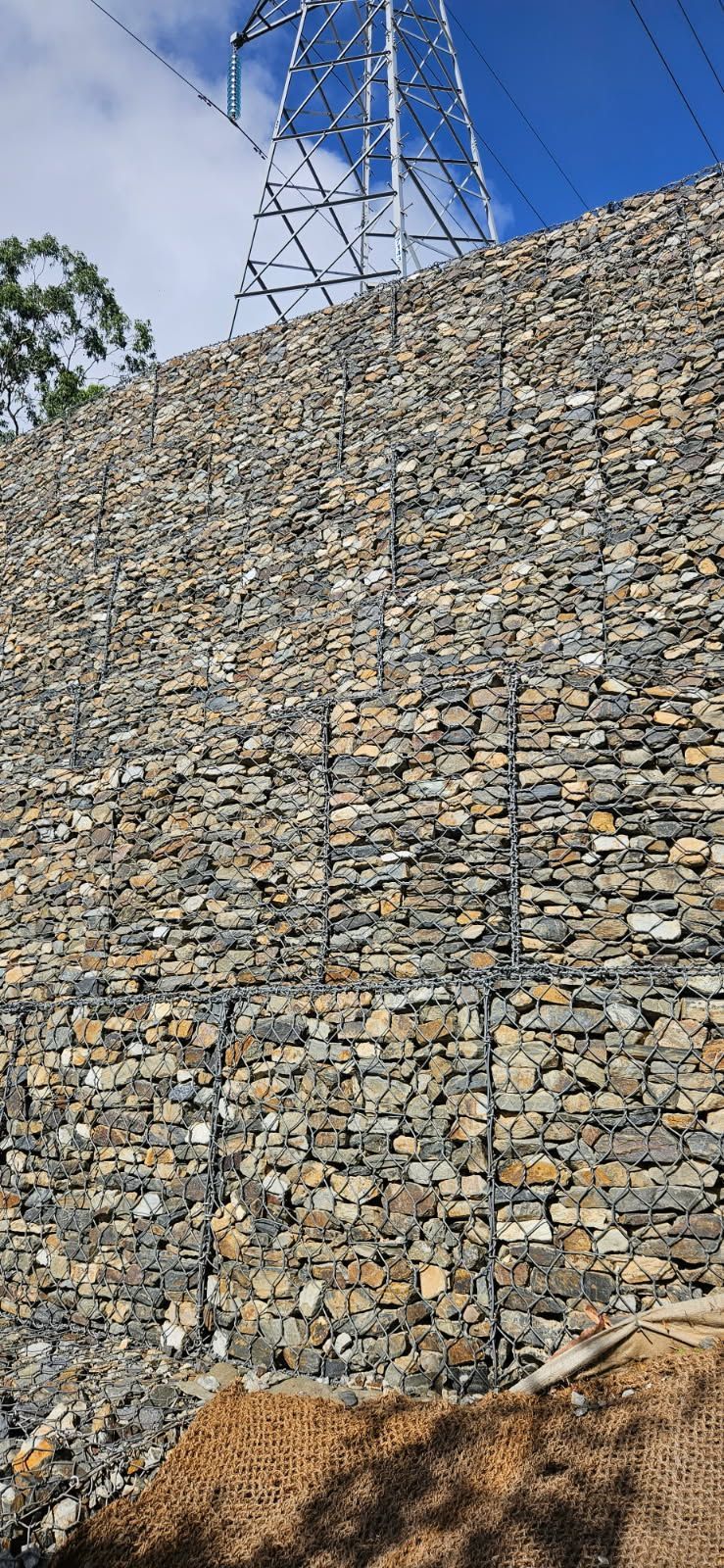 Gabion Retaining Wall Supporting a Hillside — STJ Earthmoving in Mareeba, QLD