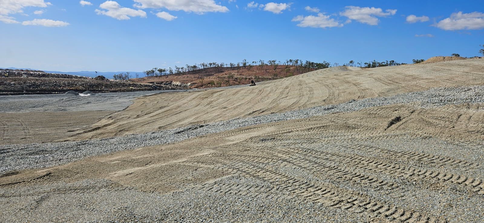 A Construction Site With a Gravel Surface and Tire Tracks — STJ Earthmoving in Mareeba, QLD