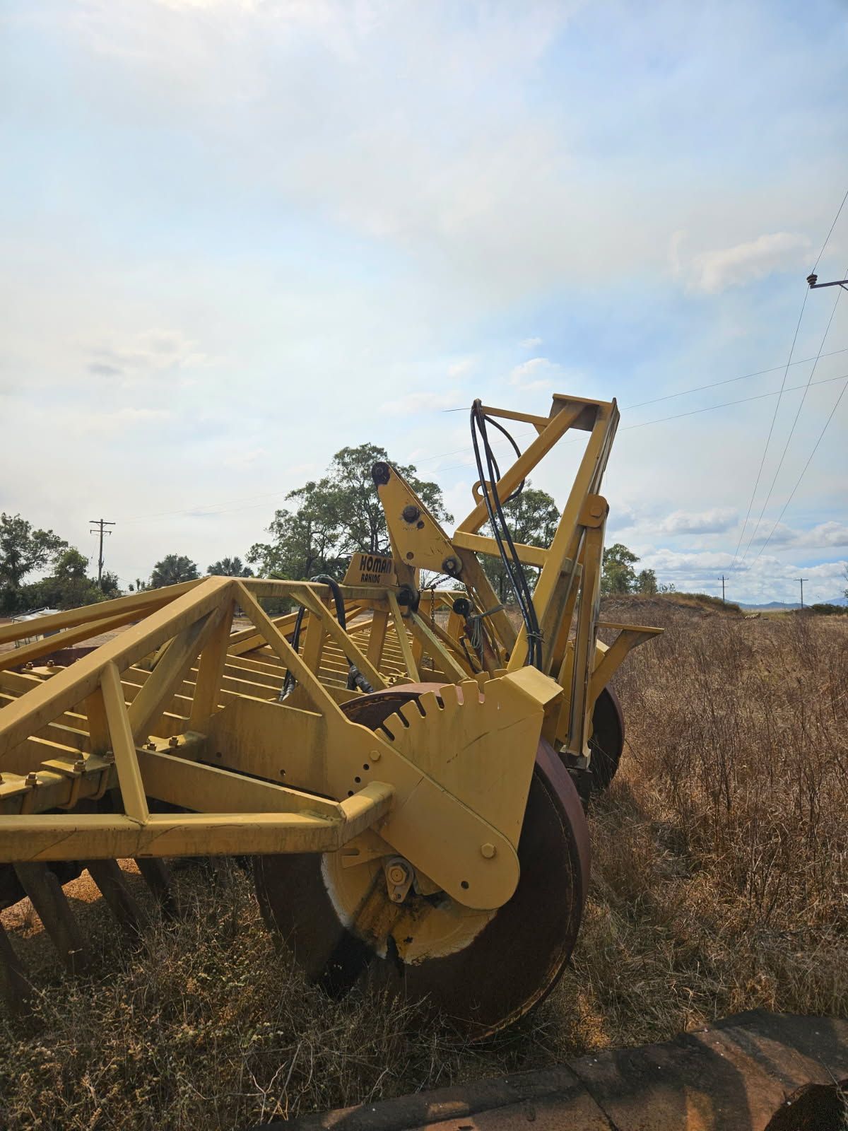Yellow Farm Disc Harrow in a Field — STJ Earthmoving in Mareeba, QLD