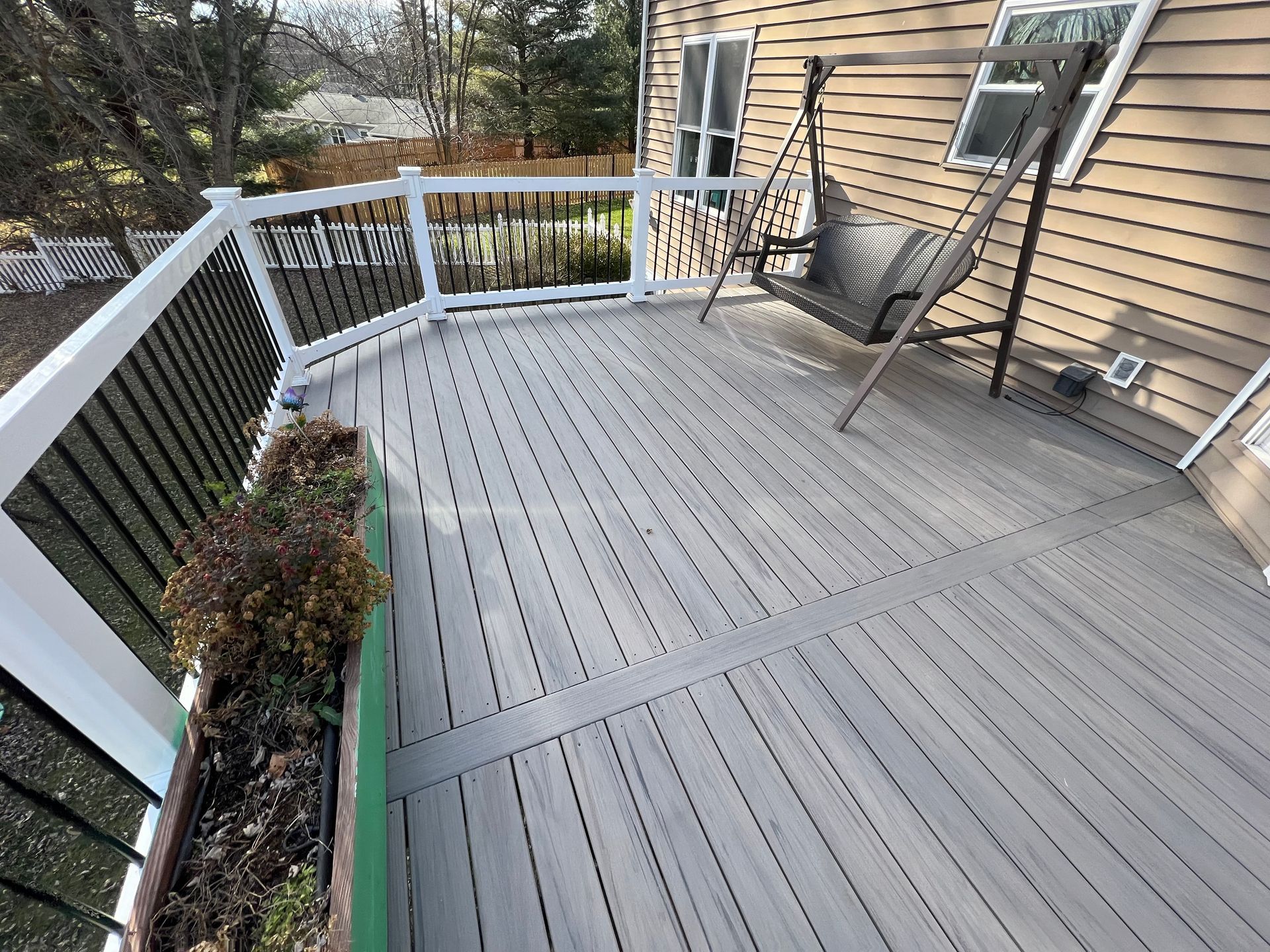 a house with a large deck and sliding glass doors