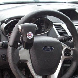 Steering wheel of a Ford car with a hand control device for drivers with disabilities.
