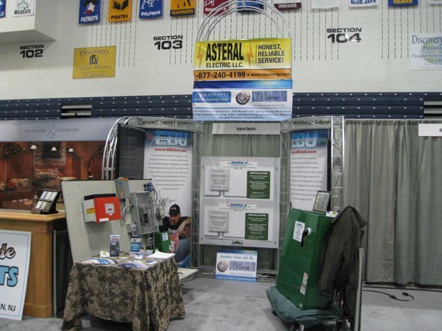 An asteral sign hangs above a table in a room