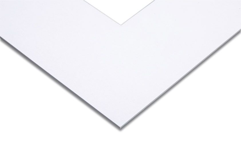 A close up of a piece of white paper on a white background.