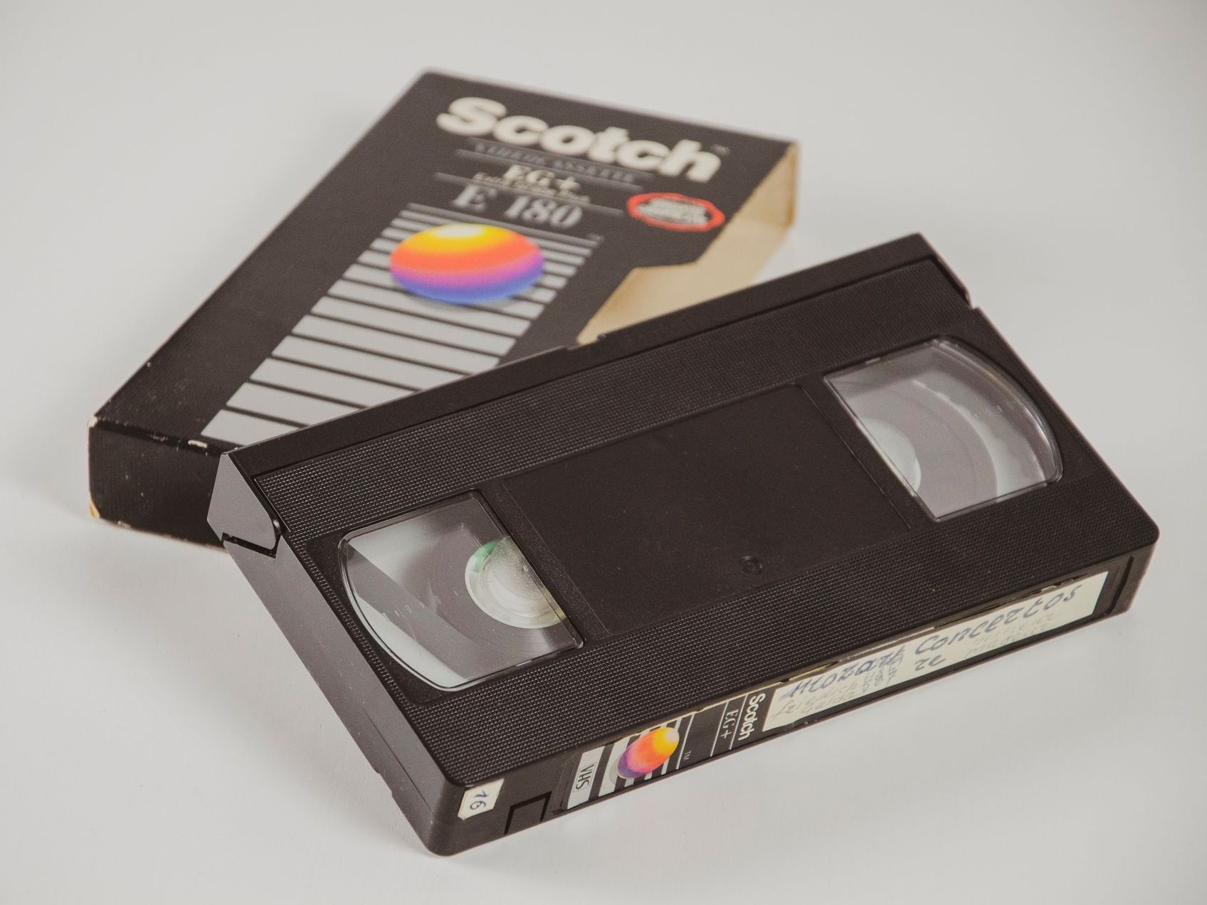 A scotch vhs tape sits next to its box