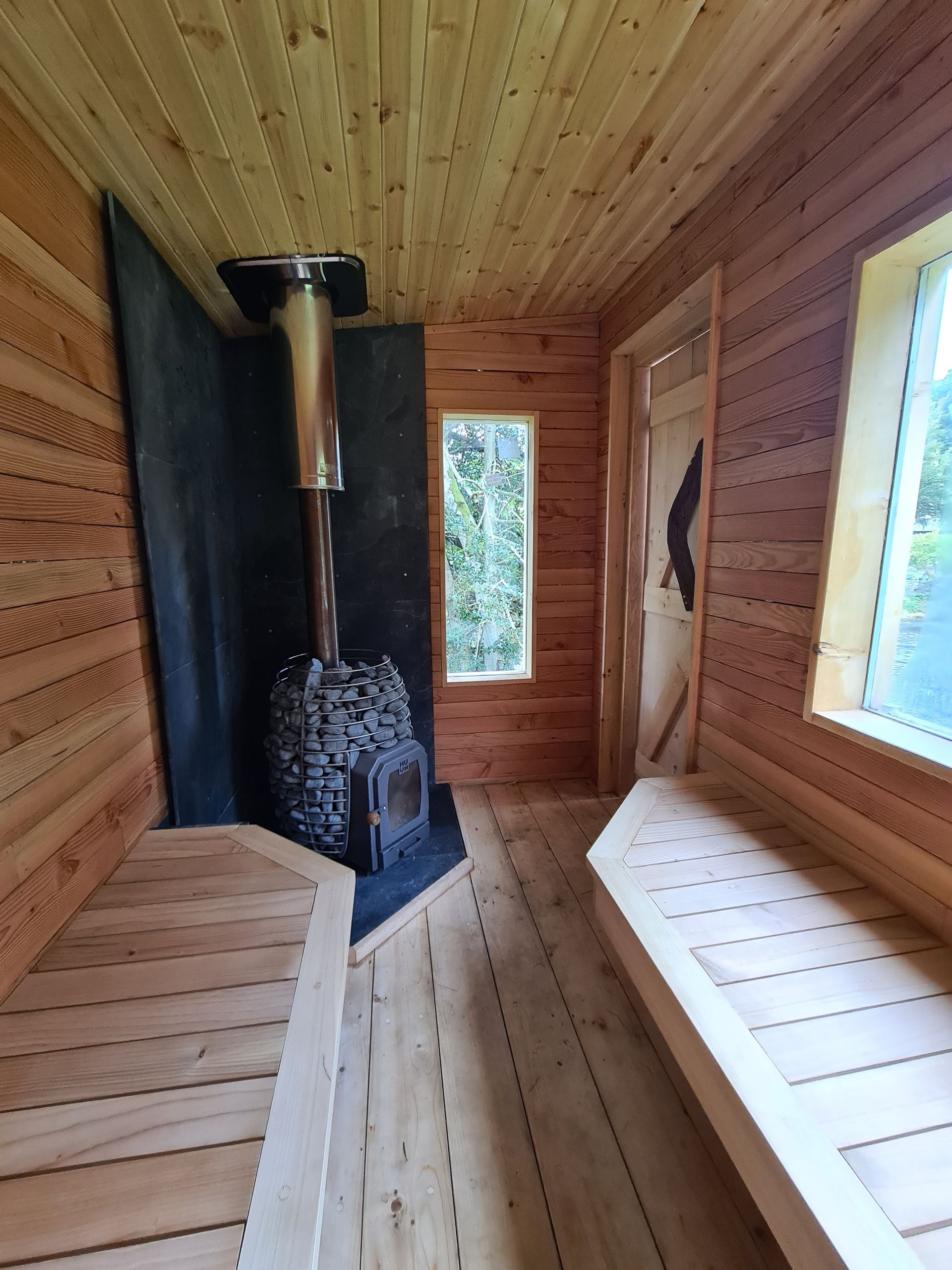 the inside of the sauna with wood fired burner at Penpont 