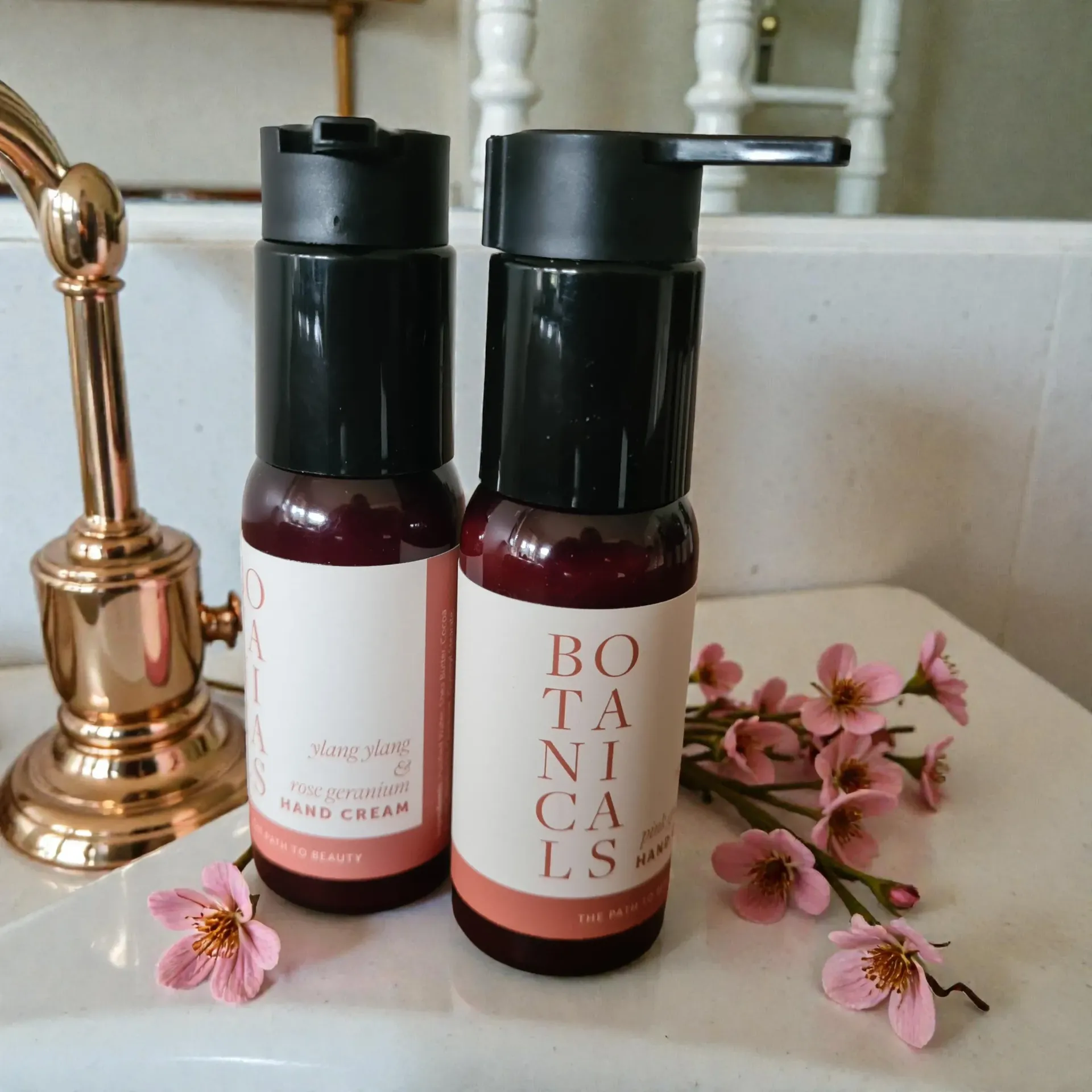 Two bottles of hand cream labeled 