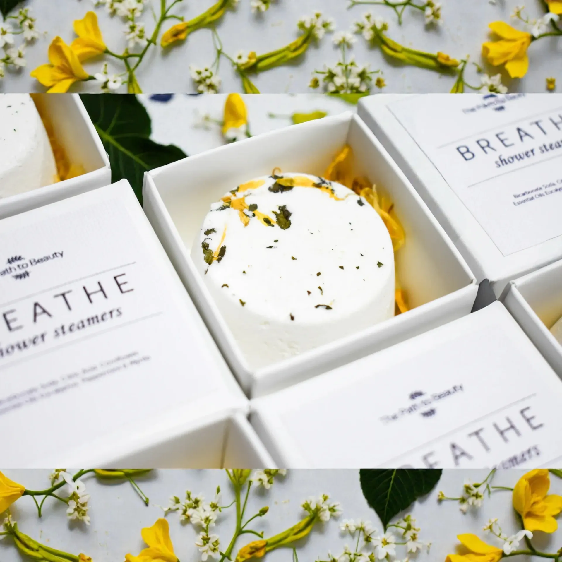 White boxed shower steamers with floral accents.