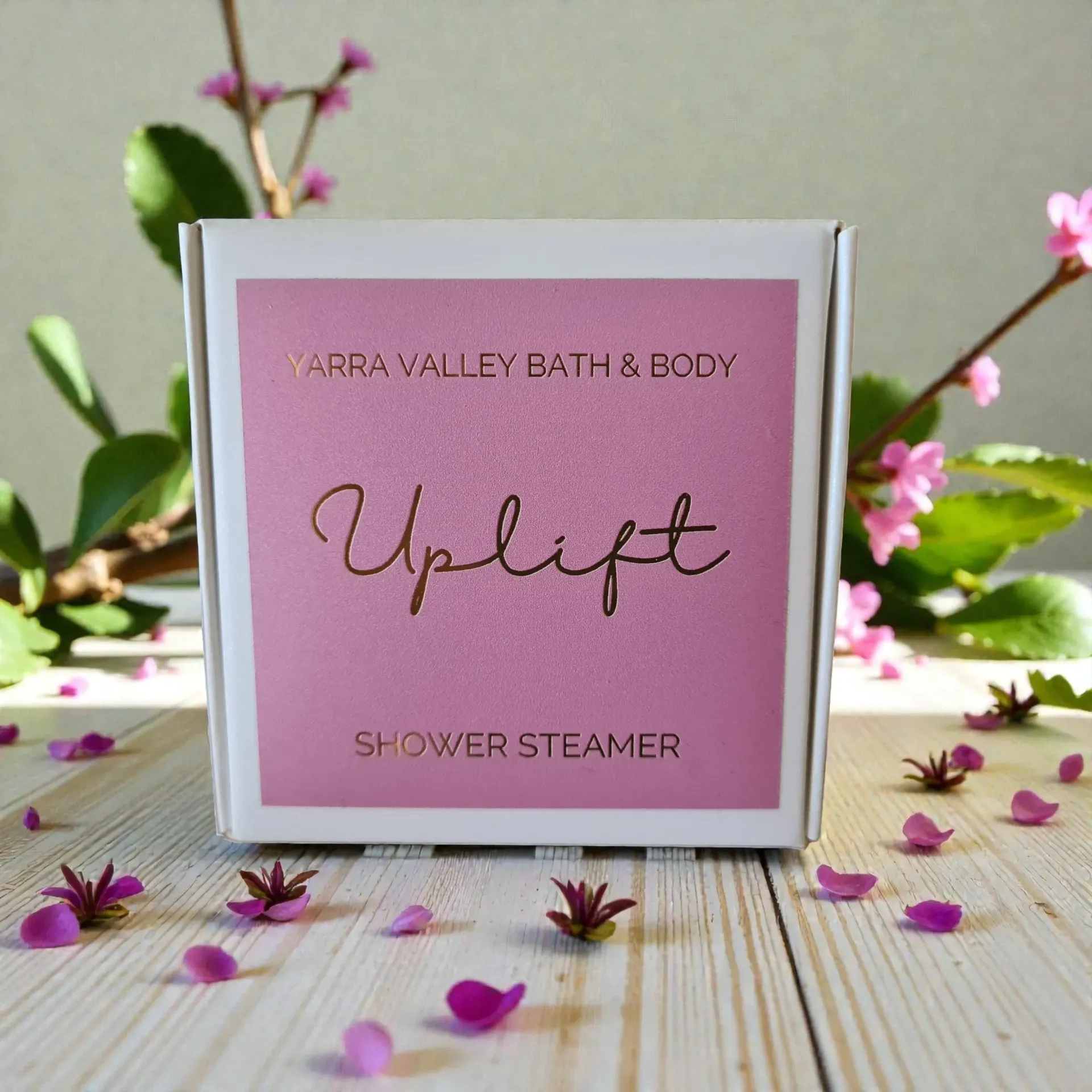 White box with pink label that reads 