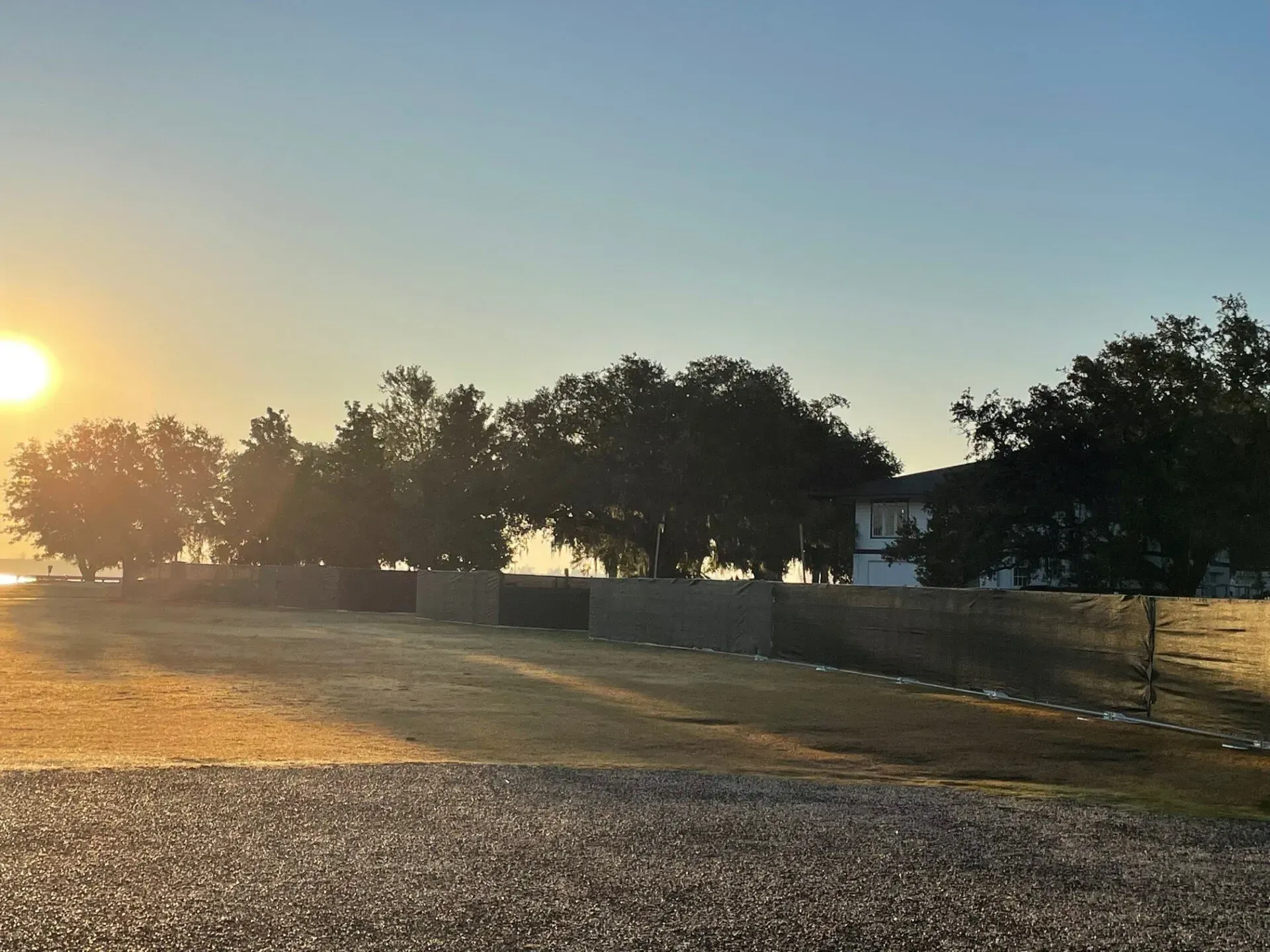 Temporary Fence and Sunset — North Charleston, SC — Access Portable Toilets