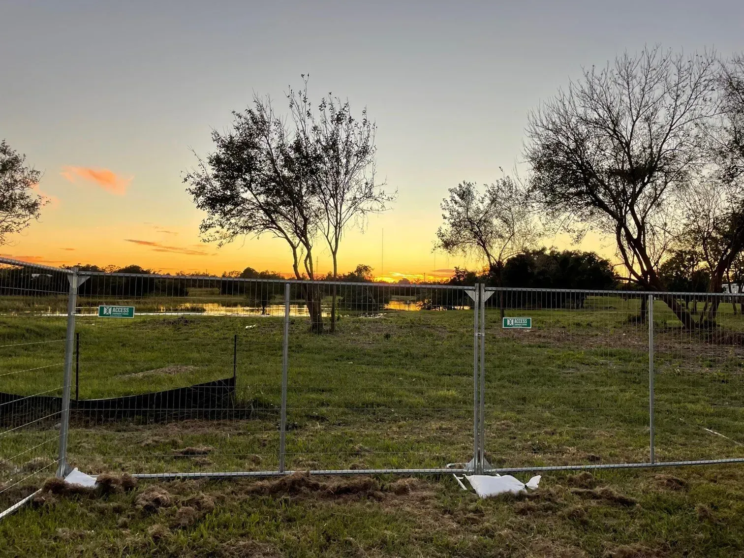 Grid Temporary Fence with Trees — North Charleston, SC — Access Portable Toilets