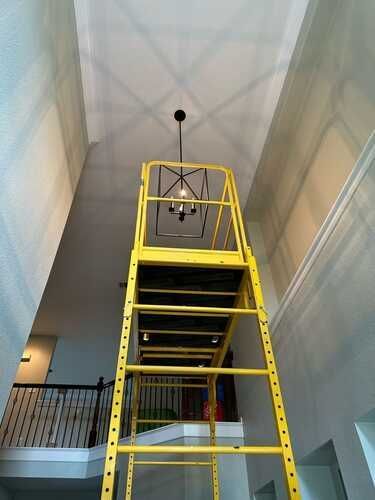 igh ceiling light fixture installation by electrical handyman in the DFW Area