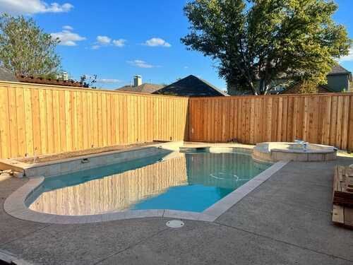 Poolside fence installation as part of exterior home repairs in Dallas-Fort Worth