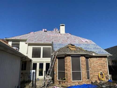 Roof repair in progress by exterior home repair contractors in Dallas-Fort Worth